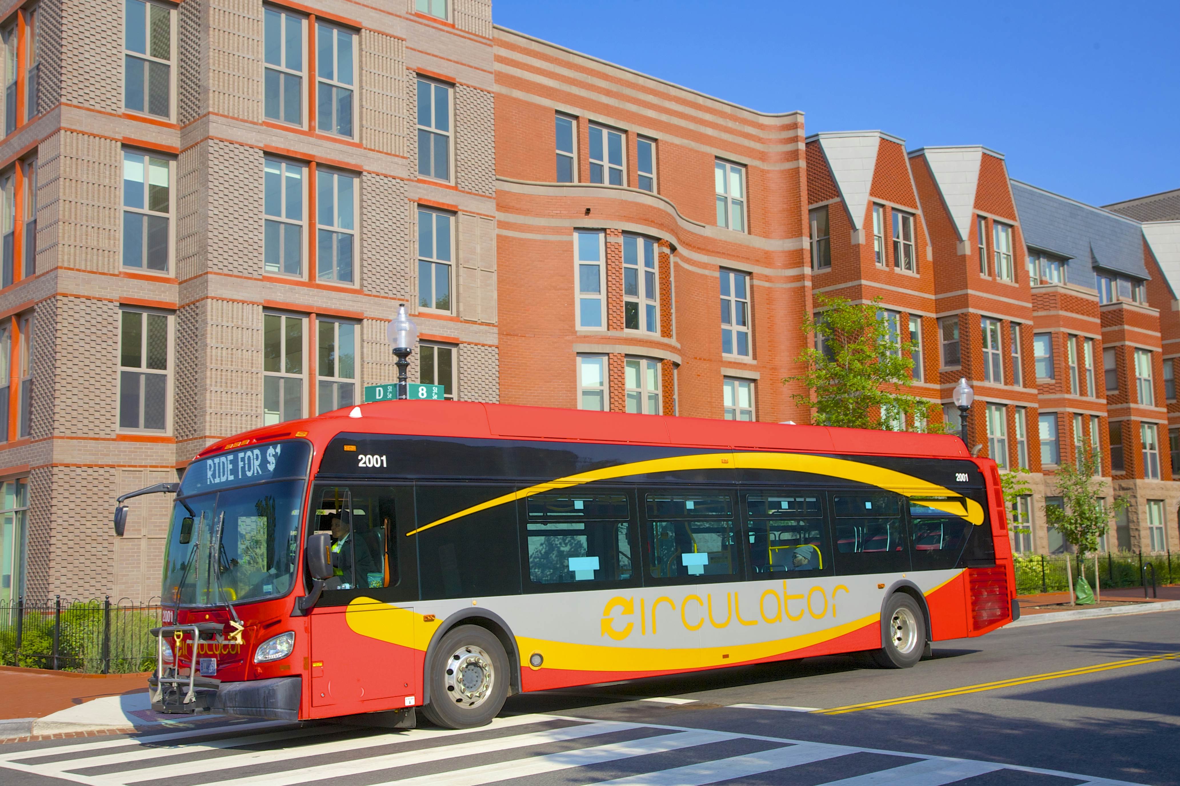 DC Circulator bus passing a building in Washington, DC