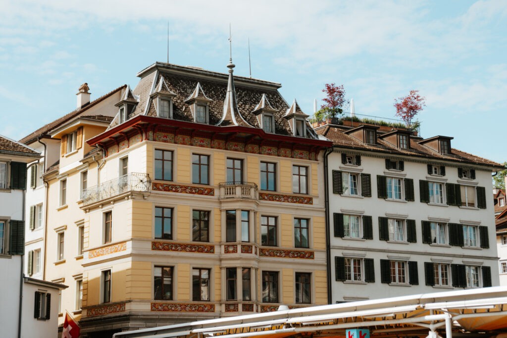 A serene view of the Limmat River flowing through Zurich's Old Town, highlighting the city's blend of nature and history.