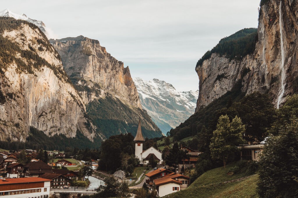 Waterfall cascading down the cliffside in Lauterbrunnen, illustrating the town's lush and dramatic landscape.