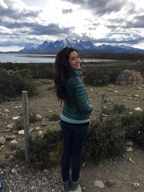 Woman hiking in the mountains, enjoying the scenery