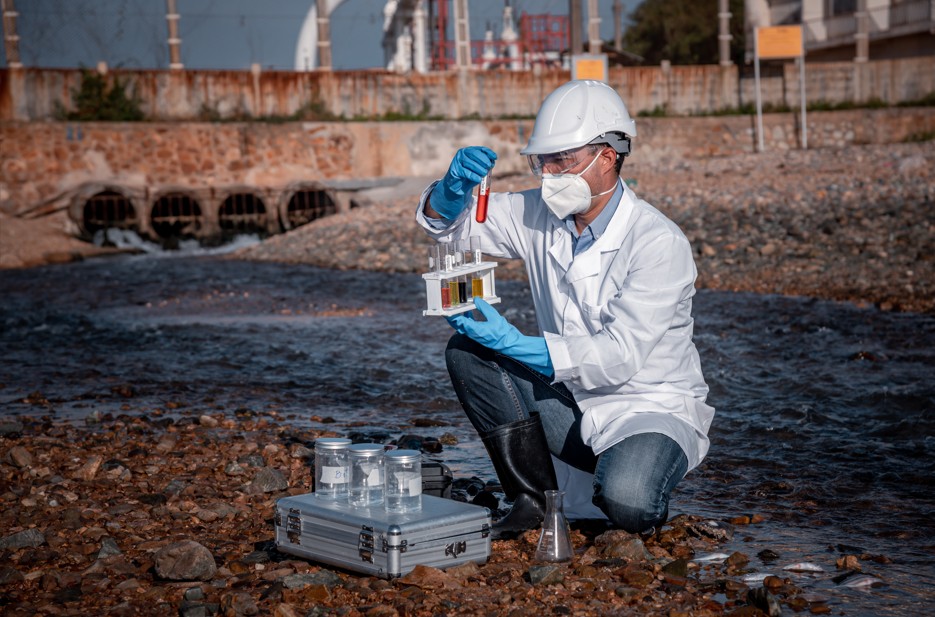Scientist wearing protective uniform and glove, conducting research in a lab