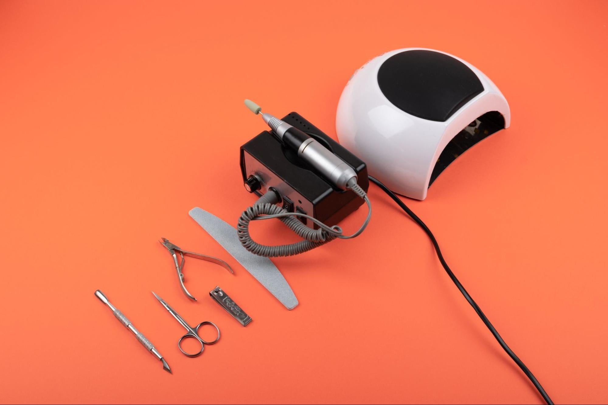 Collection of permitted sharp objects, including nail clippers, tweezers, and crochet hooks