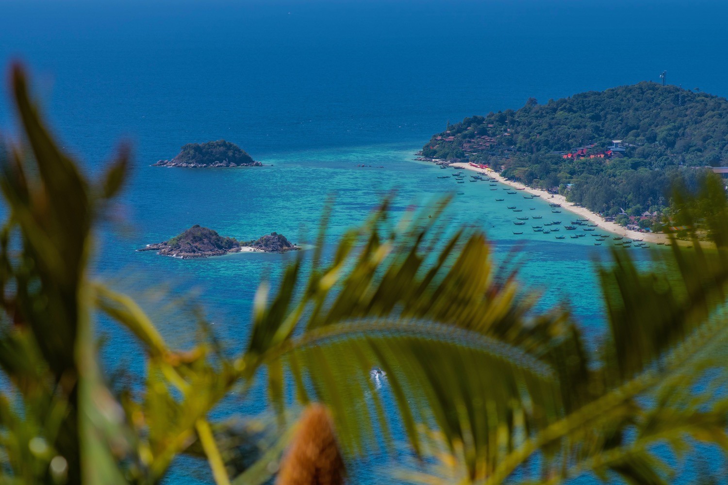Koh Lipe beach, showcasing clear turquoise waters and white sand, presenting an idyllic scene that visitors might hope to experience during a trip to Thailand in May.