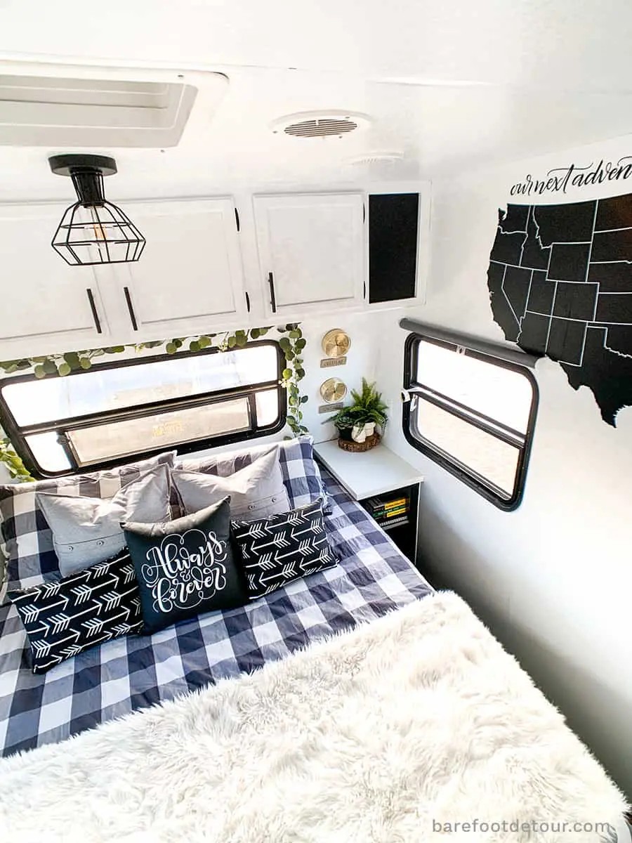 Adding decor to a remodeled travel trailer, personalizing the space with artwork and accessories