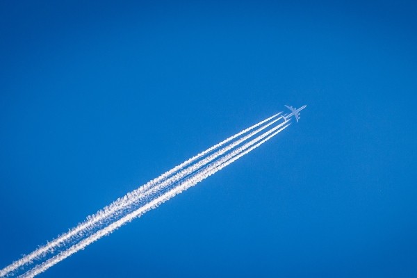 Woman Walking on Plane Aisle