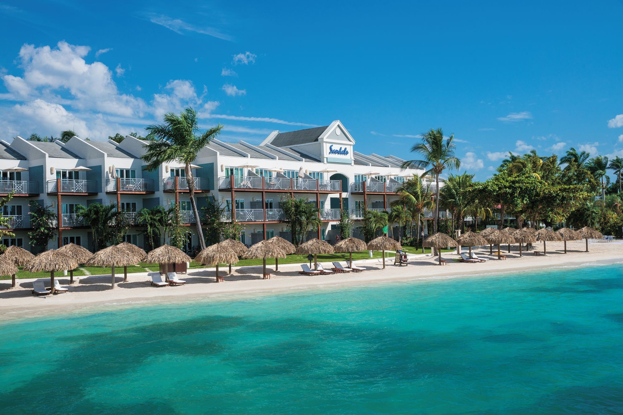 View of Sandals Negril beach with clear blue water