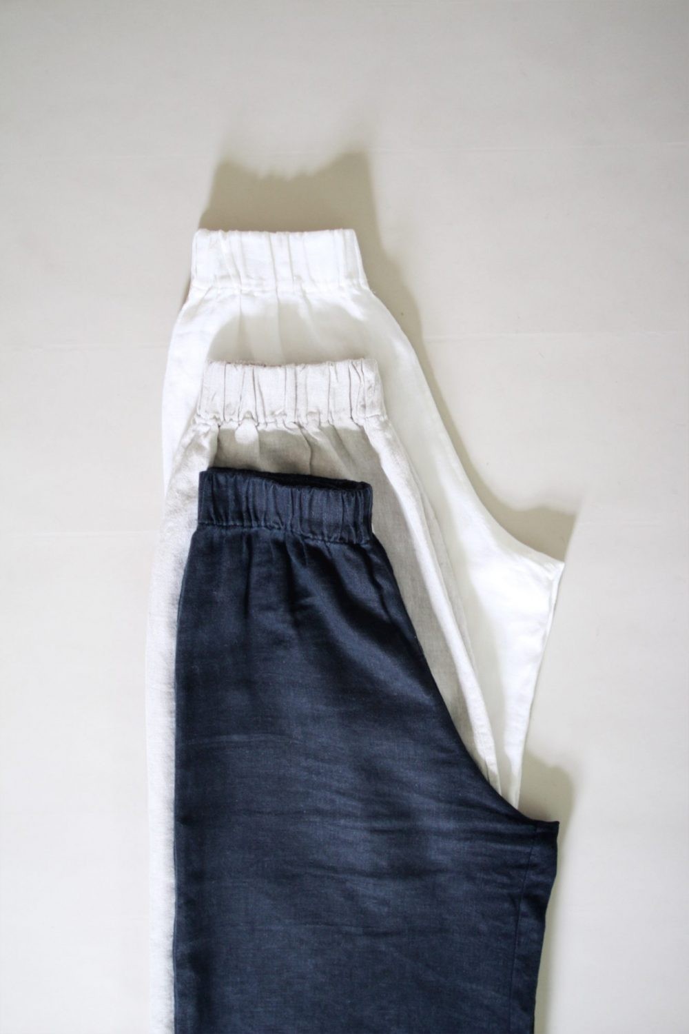 Stylish linen pants paired with a blouse and sandals, ideal for a Napa Valley winery tour, showcasing travel fashion