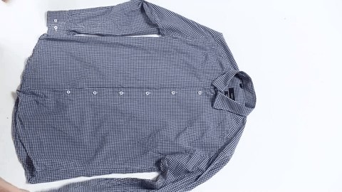 Rolling a shirt for travel efficiently