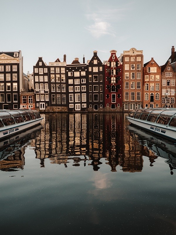 Crooked buildings along the Damrak in Amsterdam, Netherlands
