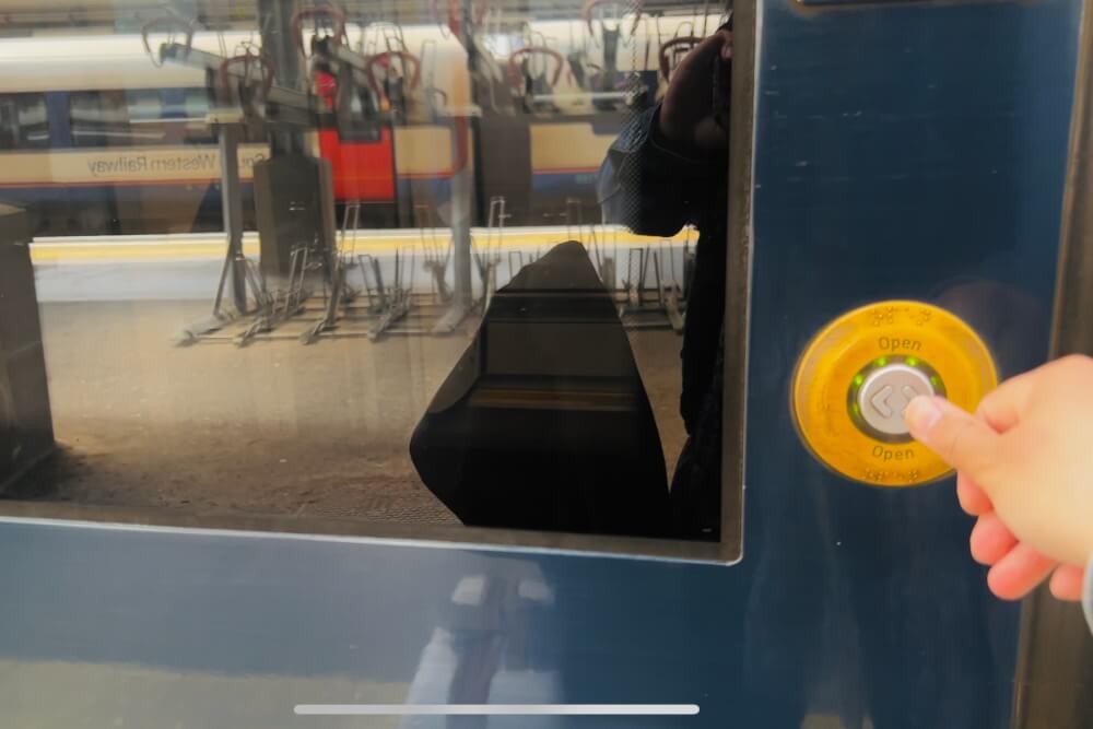 Train door open button in England