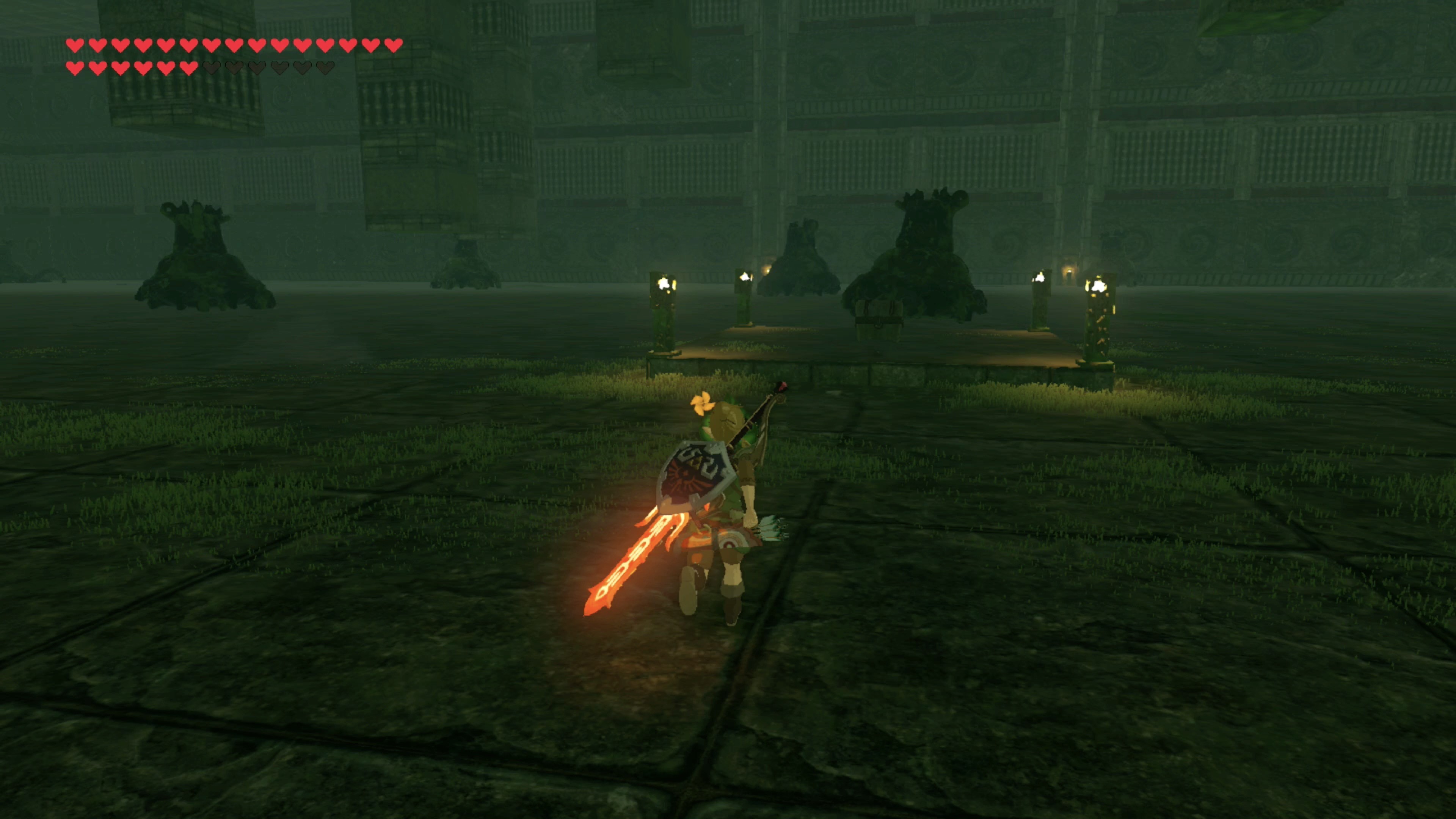 Link using a pillar for cover while battling Guardians in the underground chamber.