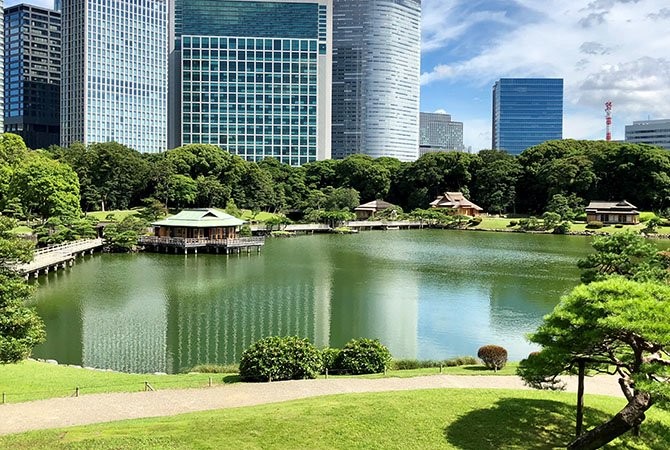 Pond in Hama-rikyu Gardens reflecting historical landscape