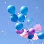 Helium balloon ascending into the sky