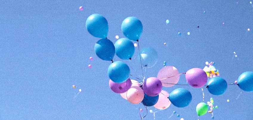 Helium balloon ascending into the sky
