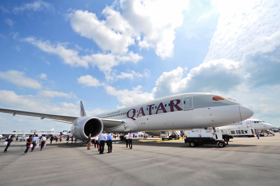 Qatar Airways airplane taking off, representing global travel opportunities for employees.