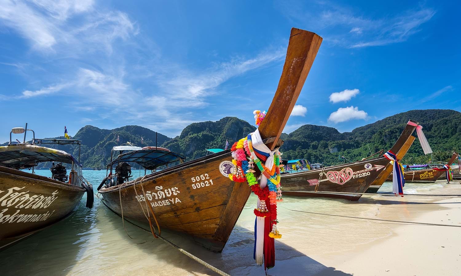 Boats docked on a beach in Thailand