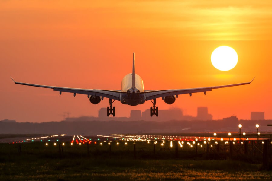Airplane landing at sunset, symbolizing the exciting career opportunities in the airline industry.