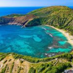 Hanauma Bay, a popular snorkeling spot in Oahu, requiring reservations to manage visitor impact