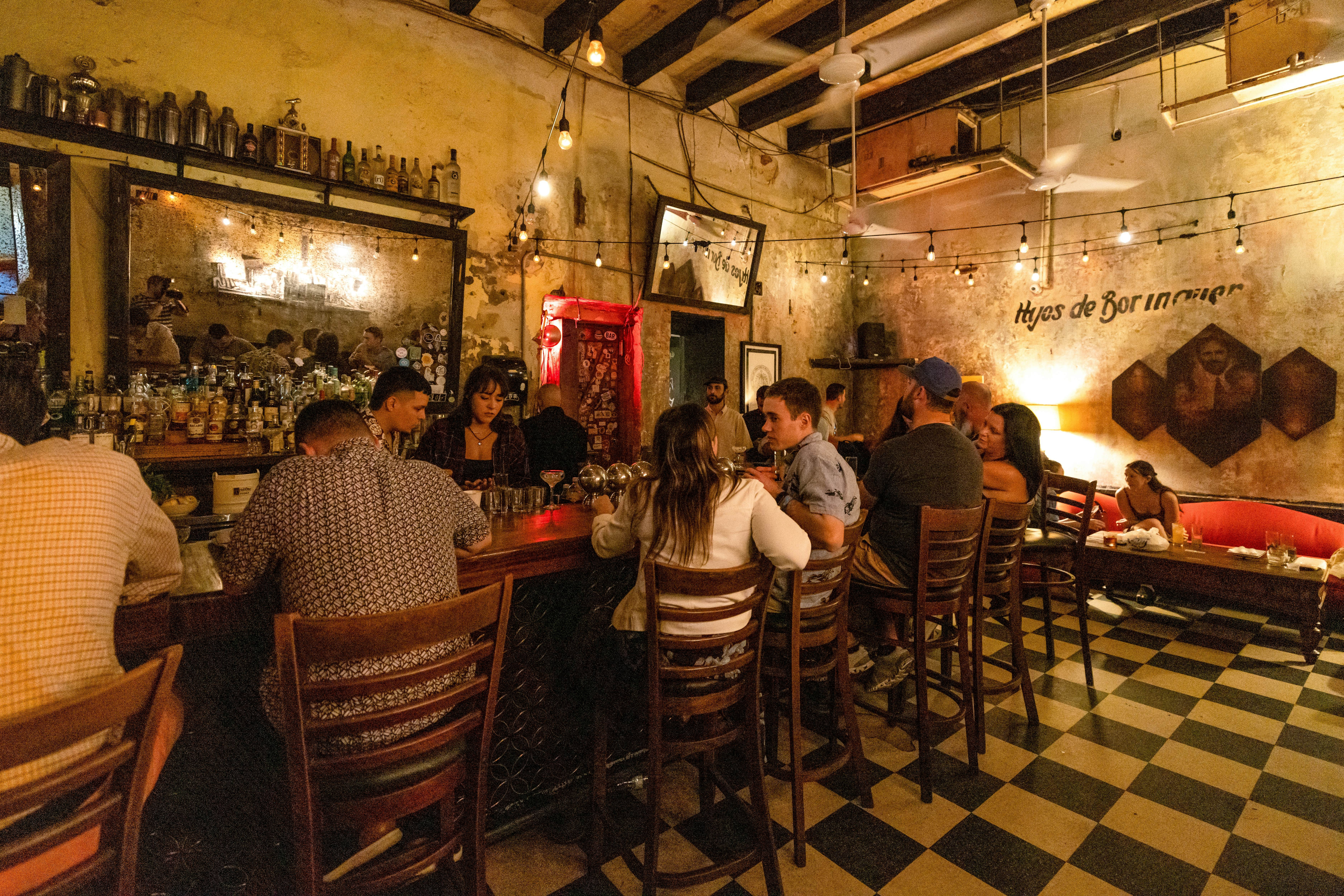 People enjoying cocktails at a stylish bar in Puerto Rico