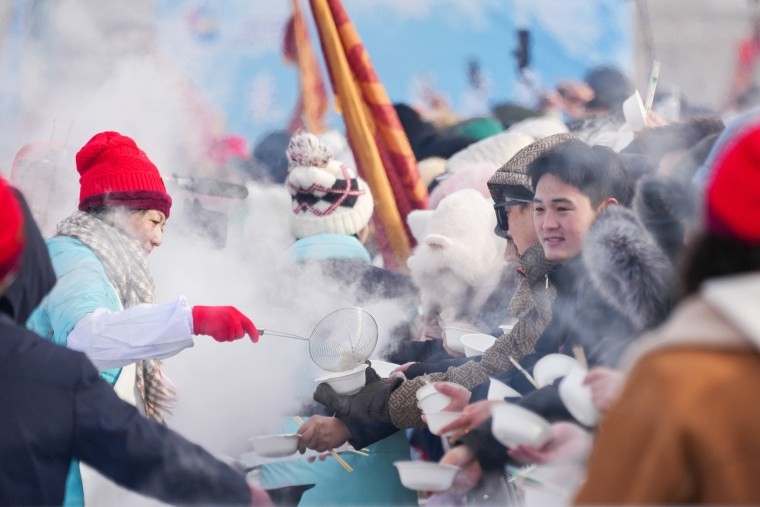 Tourists enjoying dumplings in Harbin, China