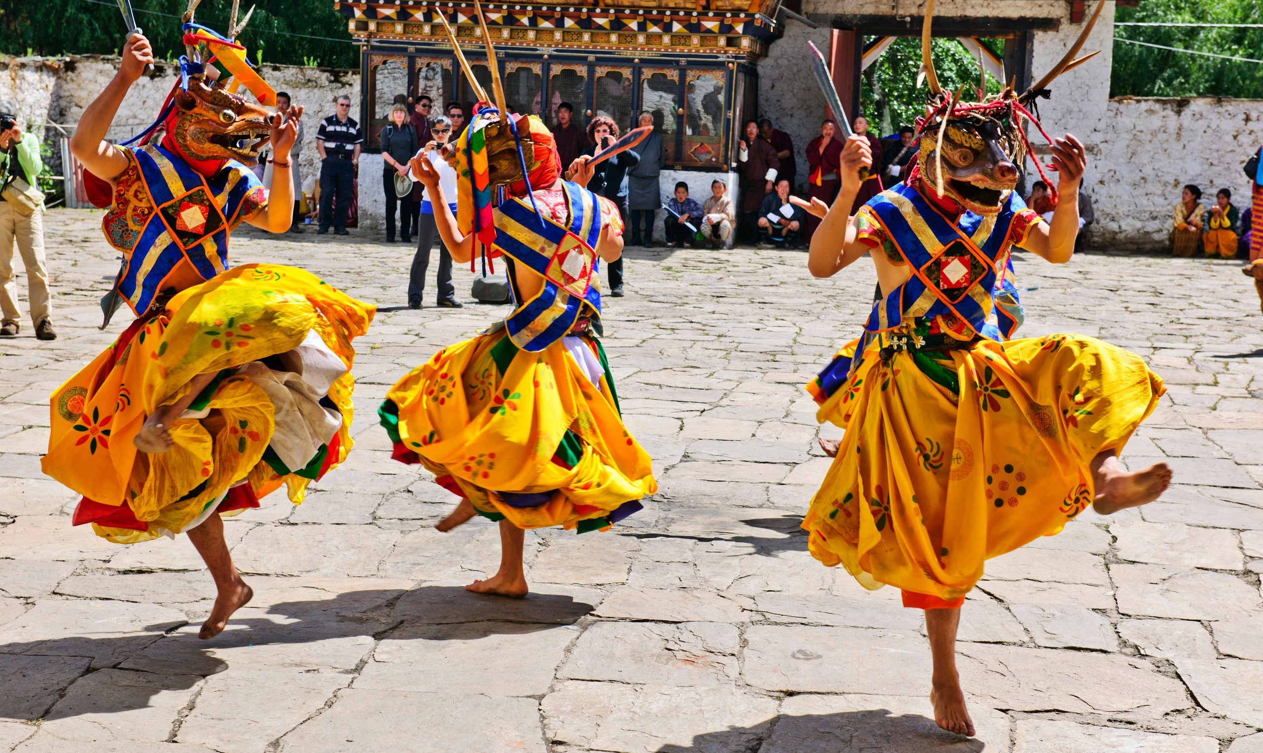 Masked dancers at a festival in Bhutan