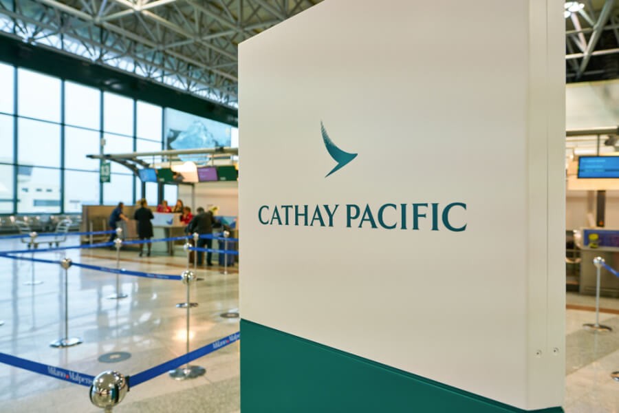 Cathay Pacific Airways airplane at an airport, indicating travel benefits for employees in Asia.