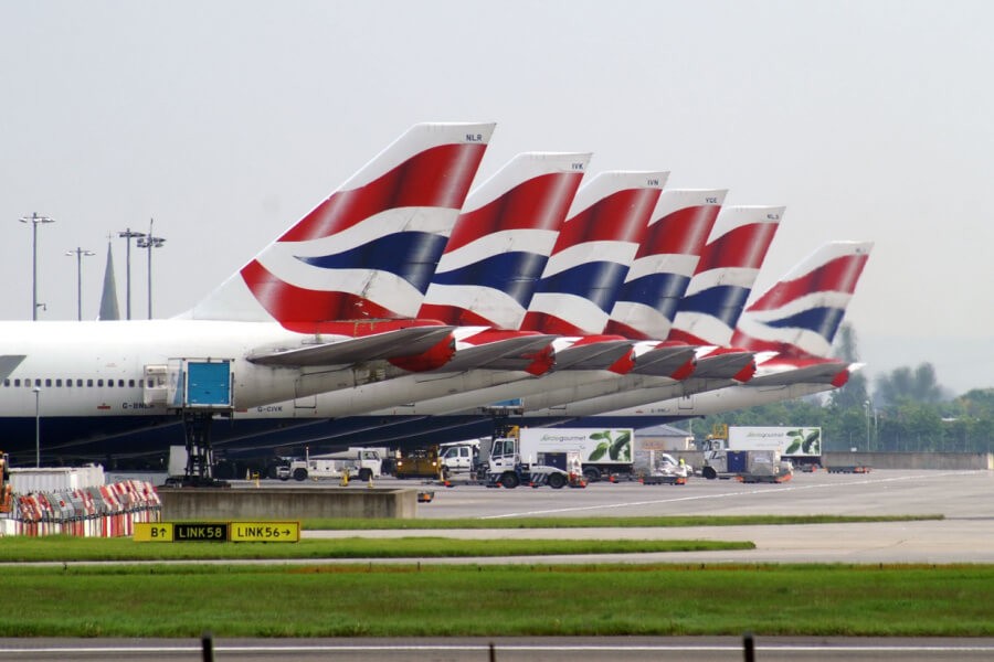 British Airways airplane soaring above the clouds, symbolizing global travel for employees.