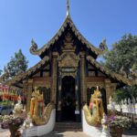 Woman admiring temple in Chiang Mai