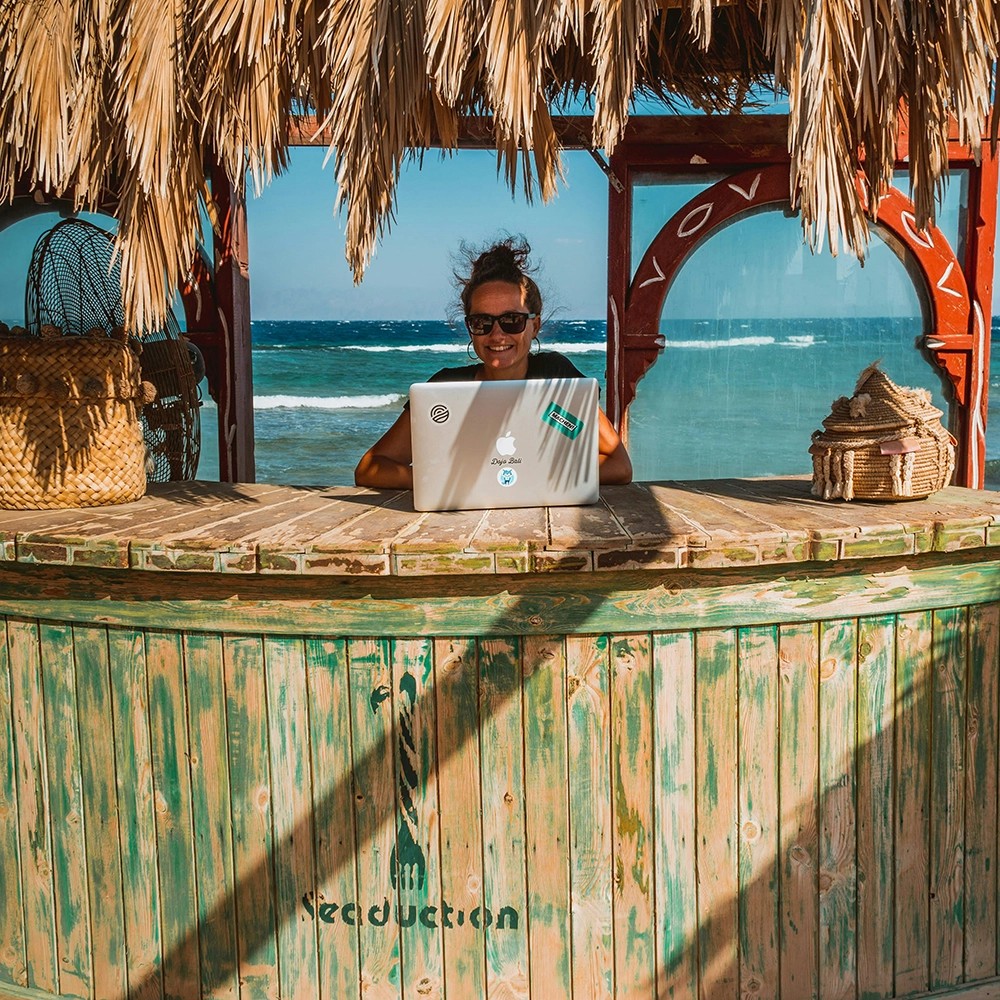 Digital nomad working on a laptop while traveling