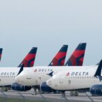 Delta Airlines tail fin and logo, a symbol of extensive employee travel benefits.
