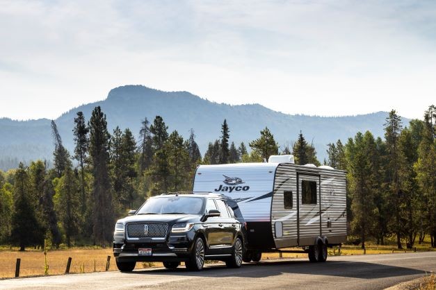 Truck pulling a Jayco Jay Flight conventional travel trailer