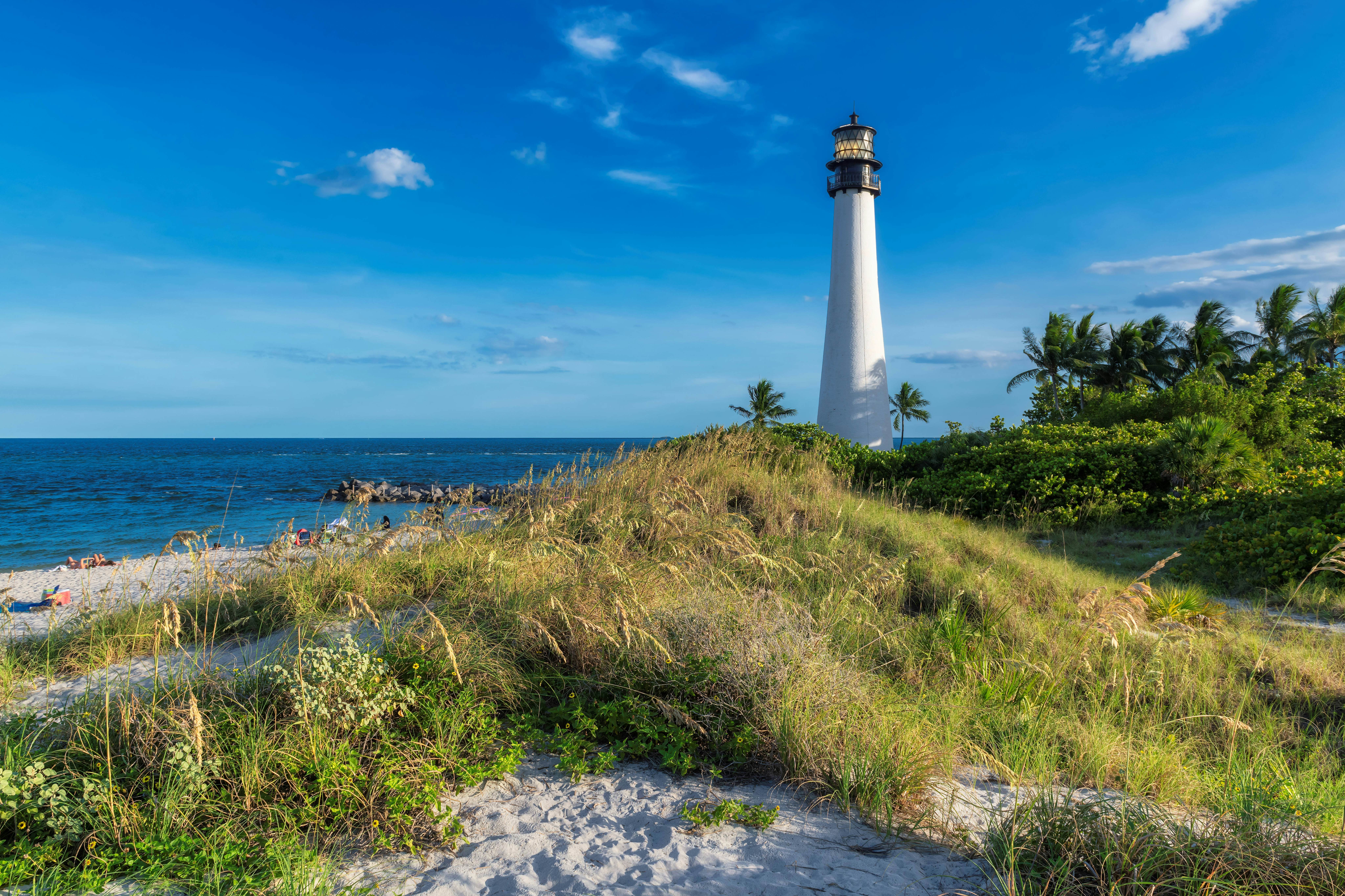 People enjoy the sunny day on the beach at Key Biscayne