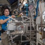 Astronaut Jessica Watkins and Bob Hines collaborate on a plant experiment aimed at sustaining crews on long missions, highlighting space's unique environment for scientific research, which includes equipment within the space station.