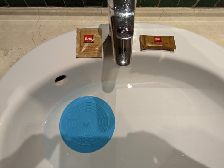 Blue universal plug with two kinds of soap