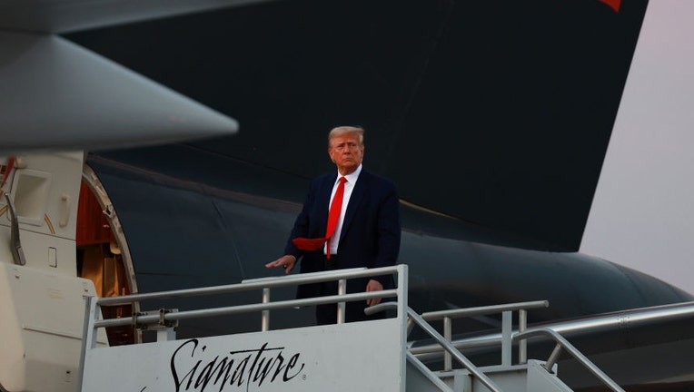 Donald Trump boards his plane