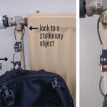 Double-sided cable lock securing travel backpack, essential for preventing theft by connecting zipper pulls.