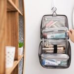 Woman packing toiletry bag for air travel