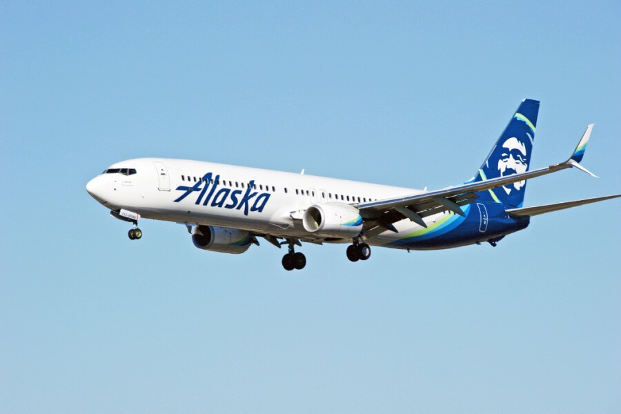 Alaska Airlines airplane on the tarmac, representing opportunities for employee travel.