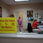 A sign welcoming patients from East Texas is displayed in the waiting area of a women’s reproductive health clinic in Santa Teresa, N.M., in June 2022.