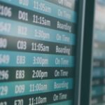 Airport departure screens displaying flight information