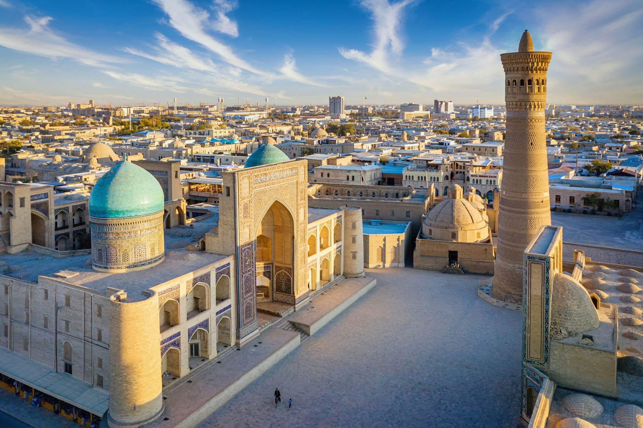 Aerial view down towards the famous Kalyan Poi Kalon Complex and Poi Kalon Minaret, Poi Kalan or Po-i-Kalyan and Mir Arab Madrasah (right side) in the center of the old town of Bukhara