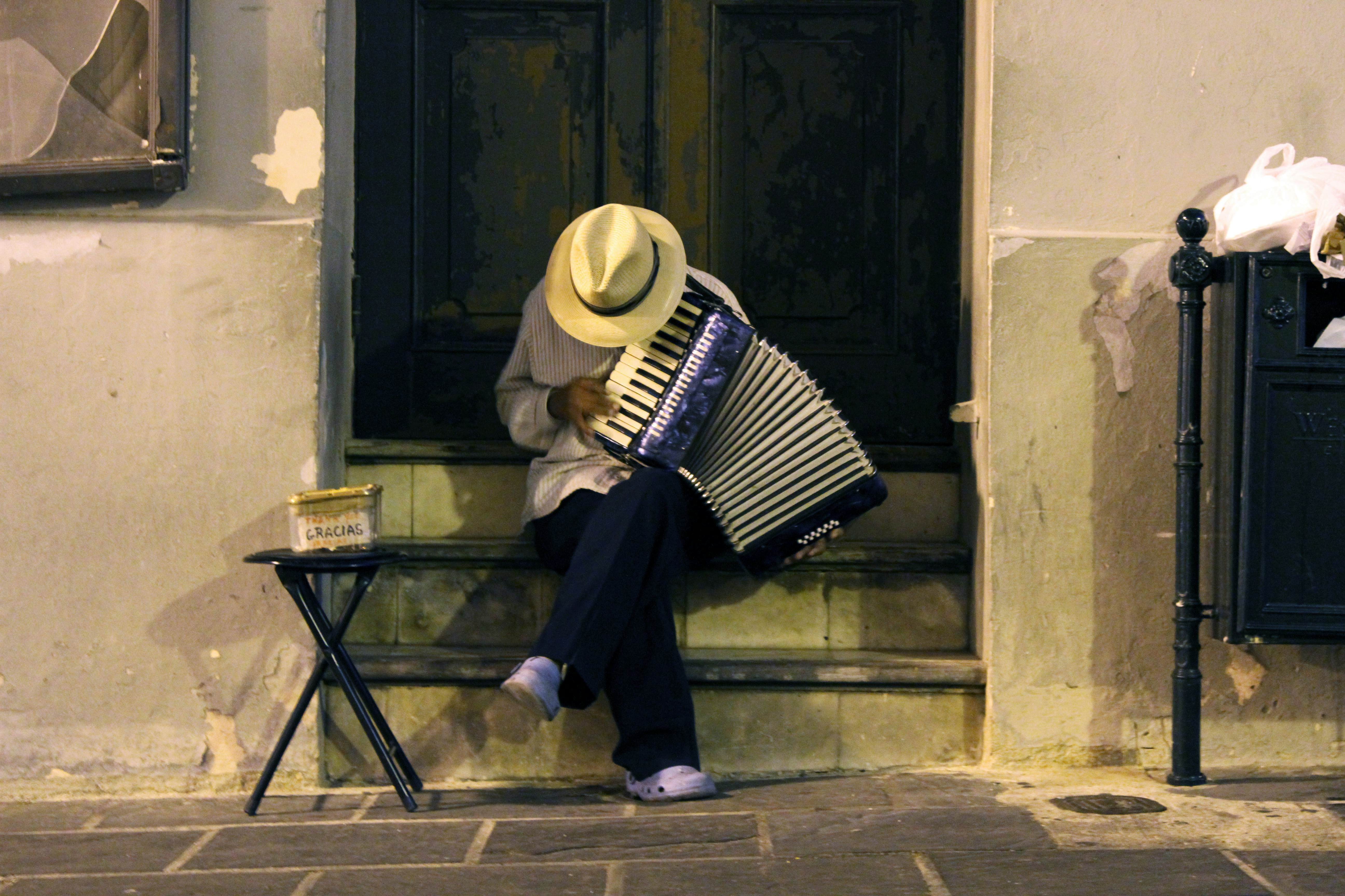 A man playing an accordion in Old San Juan