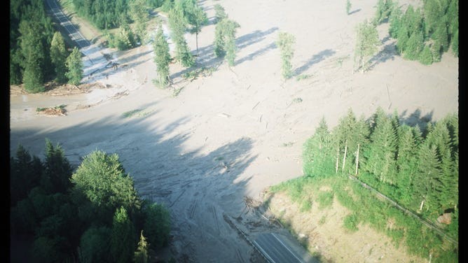 Ash-covered landscape near Mt. St. Helens following the 1980 eruption, illustrating the extensive devastation caused by the volcanic event.