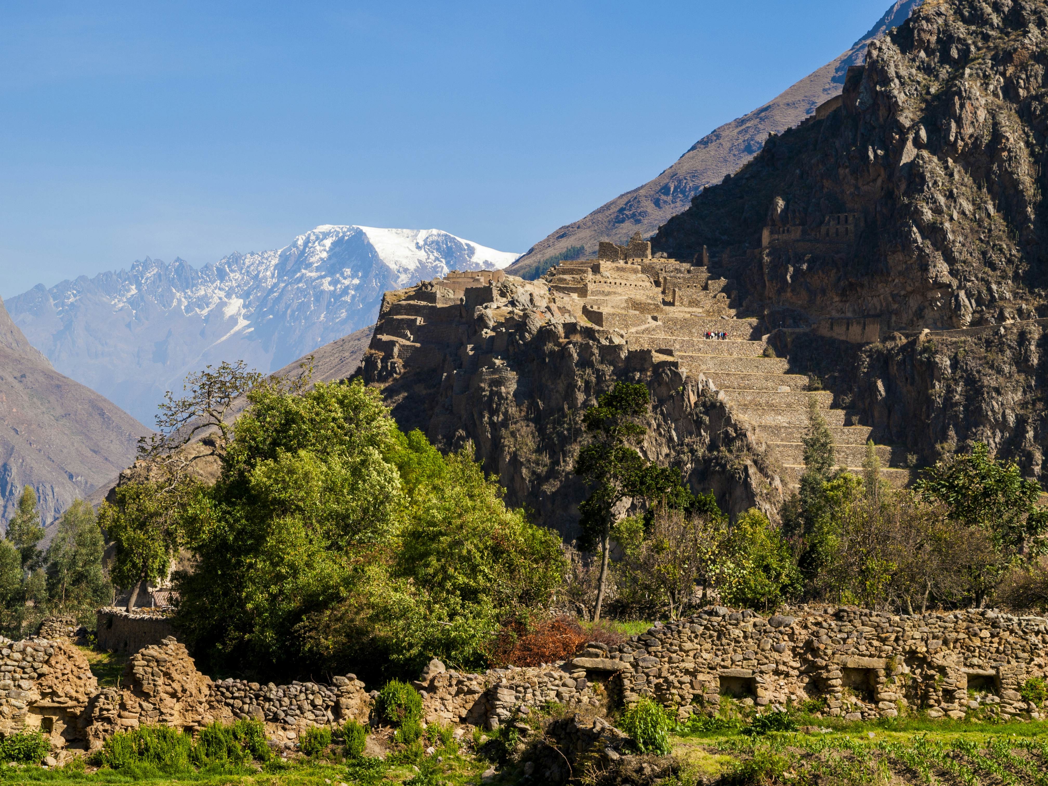 Panoramic view of the Ollantaytambo ruins, showcasing the intricate stonework and strategic location in the Sacred Valley, Peru.
