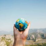 Someone holding a globe, wishing for safe travels
