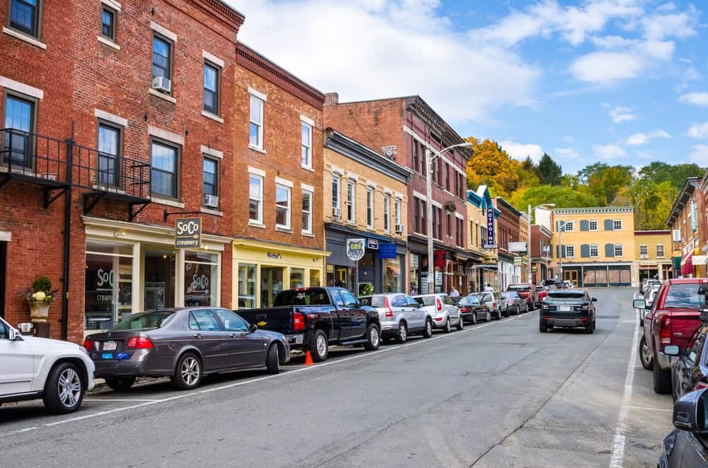 A street in Great Barrington shows a quaint New England town with shops and restaurants.