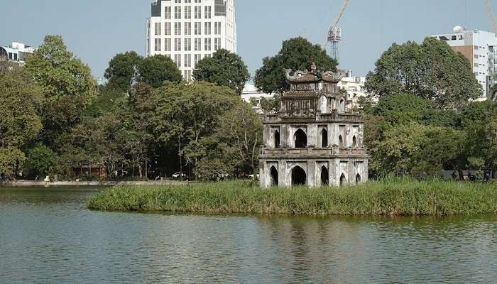 A temple on the Hoan Kiem Lake in Hanoi, Vietnam highlighting the city's cultural beauty