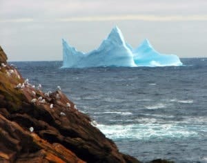 Cape Spear in Newfoundland and Labrador, showcasing the historic lighthouse and the iceberg sightings during winter, highlighting the easternmost point of North America.