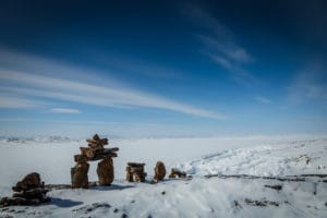 Iqaluit, Nunavut, showcasing the surreal winter landscapes and the starry night sky.
