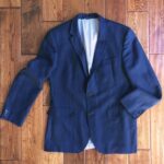 Folding a navy blazer for travel
